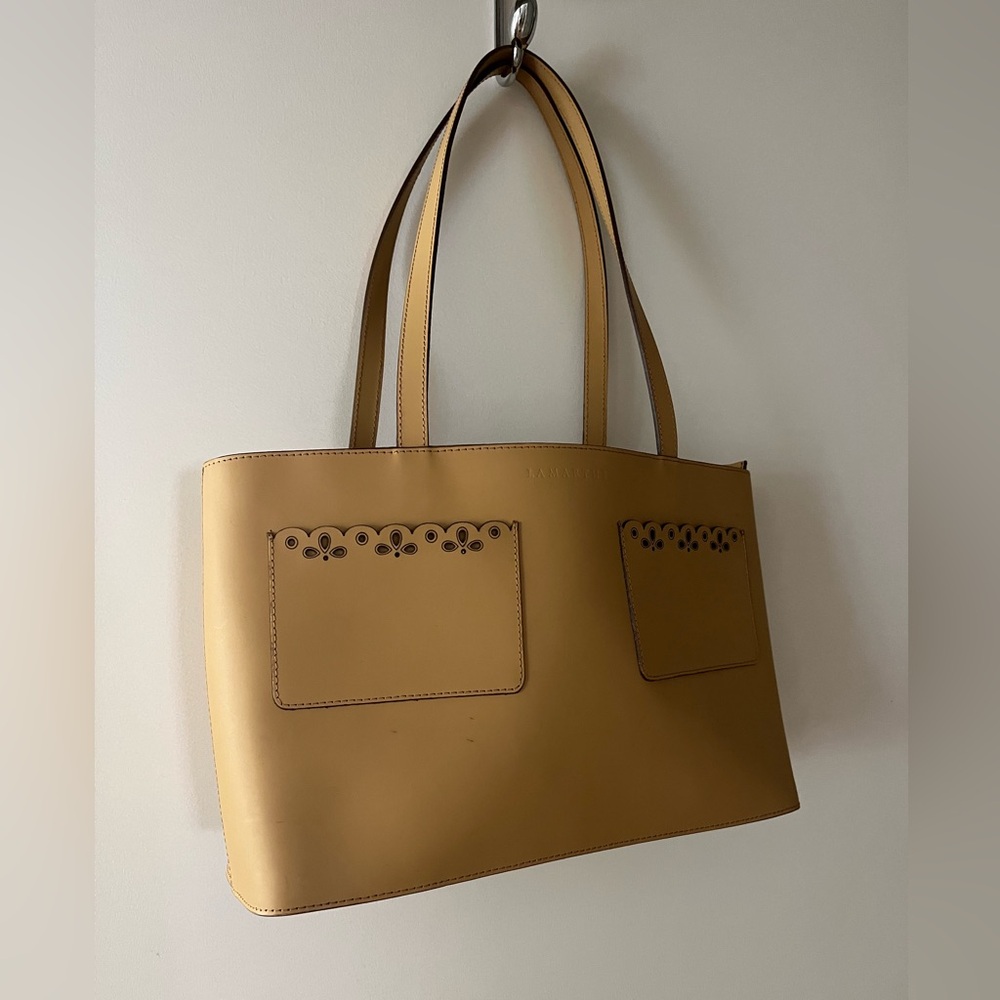 Tan Lamarthe Tote with detailed pockets on the outside.